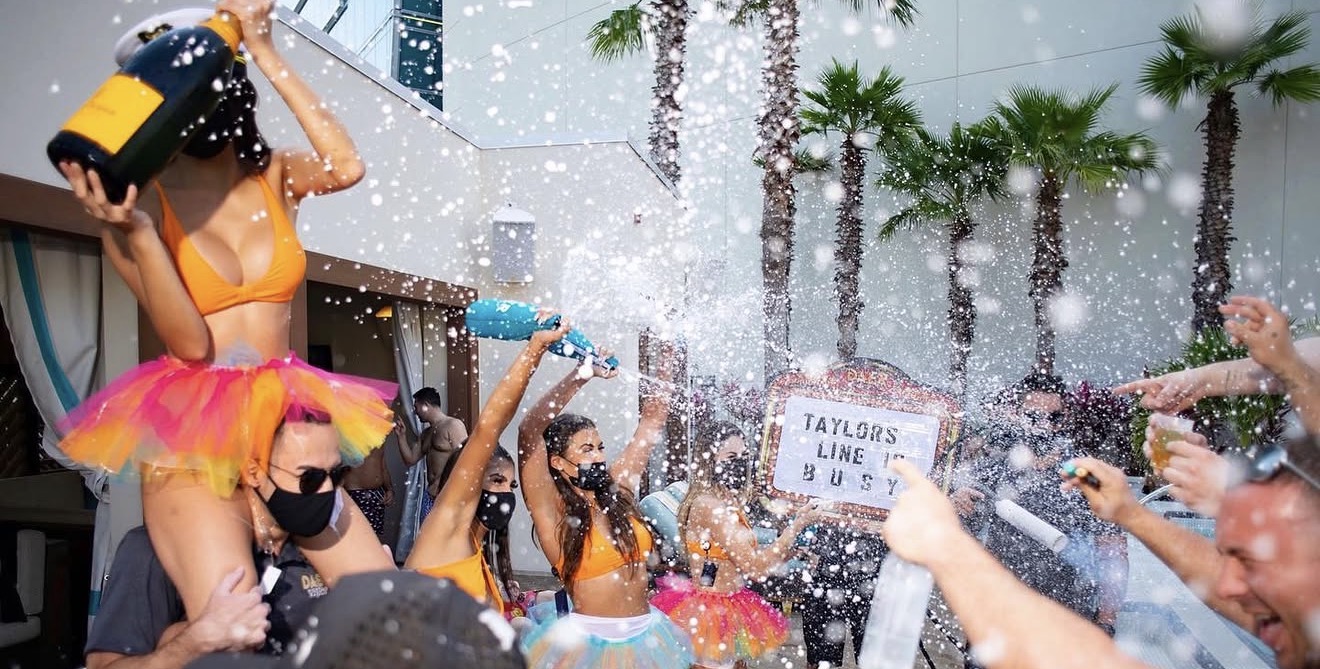Daer Dayclub VIP bottle parade confetti explosion performers colorful tutus champagne foam party
