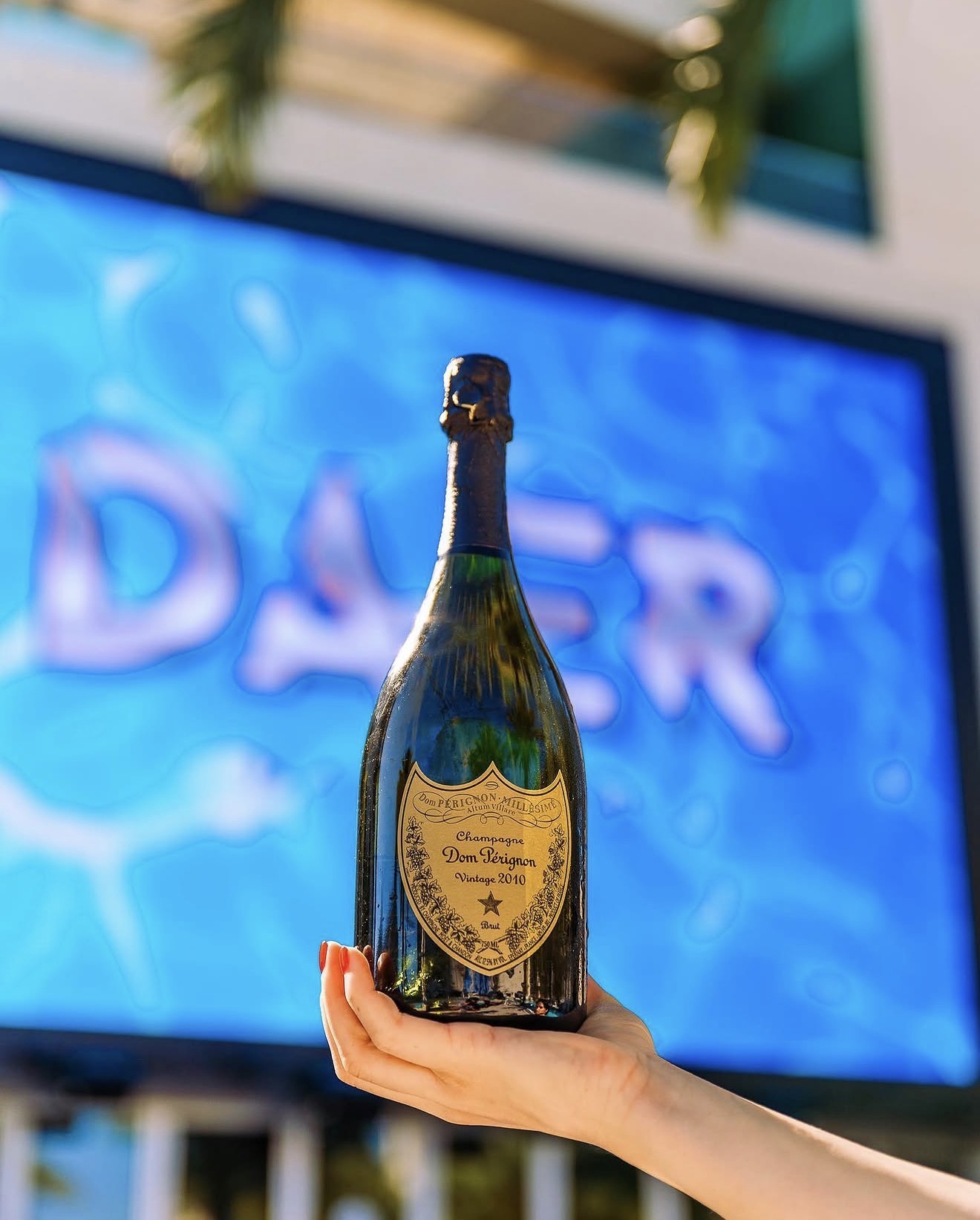 Daer Dayclub Dom Perignon champagne bottle VIP service DAER LED screen pool party