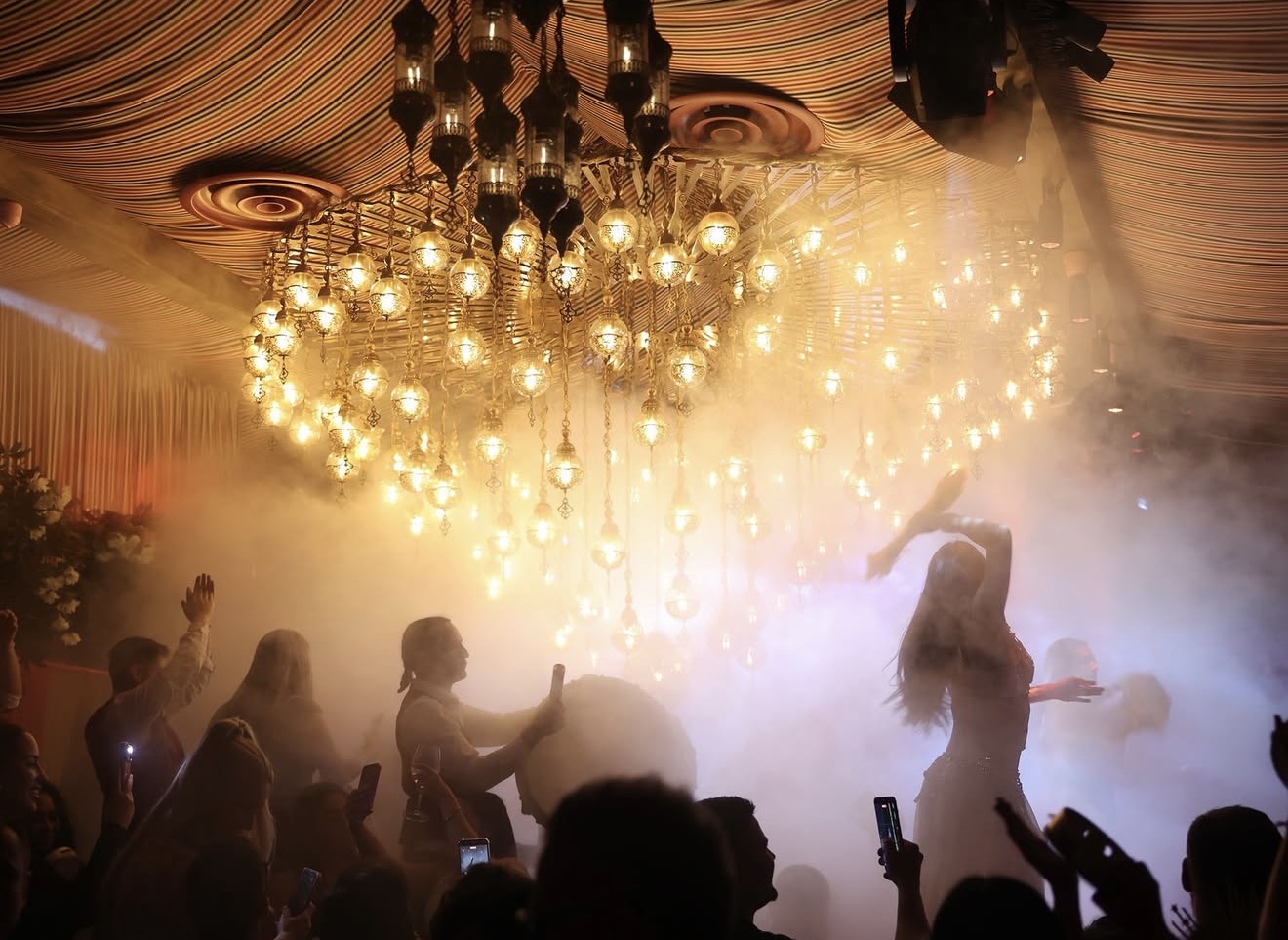 Habibi Miami River live entertainment smoke effects Moroccan lantern chandeliers dancer crowd Miami River restaurant Habibi Miami River live entertainment smoke effects Moroccan lantern chandeliers dancer crowd Miami River restaurant
